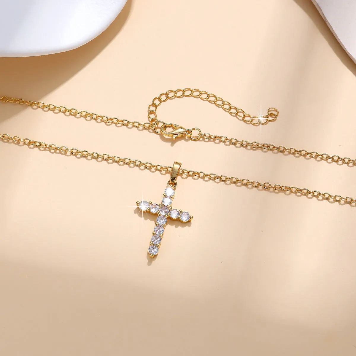 Gold plated cross necklace for women with cubic zirconia stones on a 45 cm chain, shiny finish