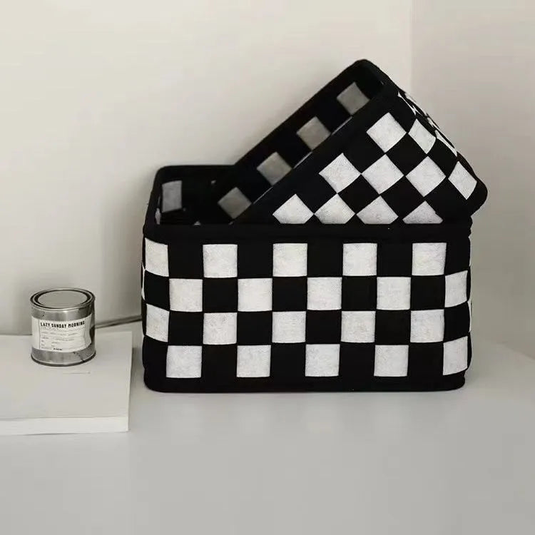 Checkerboard patterned folding felt storage basket showing collapsible sides.
