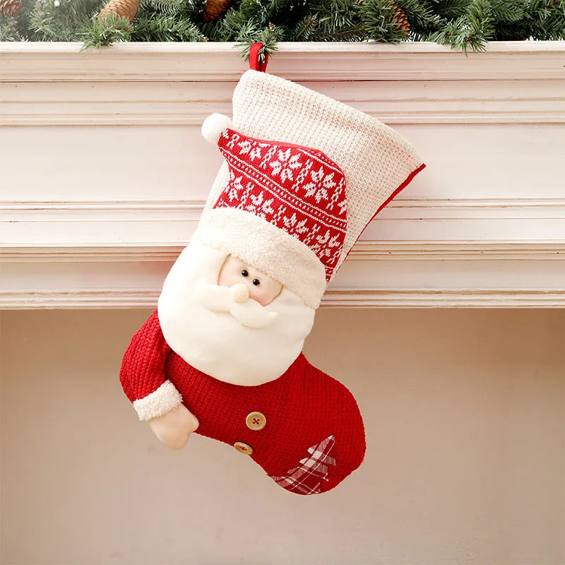 Large red and white knitted Christmas stocking with Santa Claus design for fireplace decoration