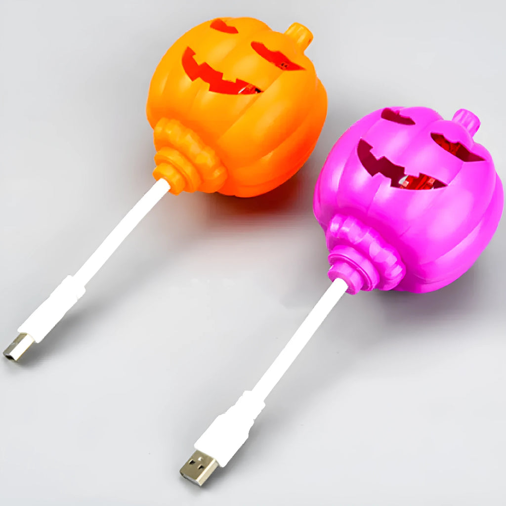 Plastic pumpkin-shaped decorative lamp with USB charging cable, showing purple or yellow light option.