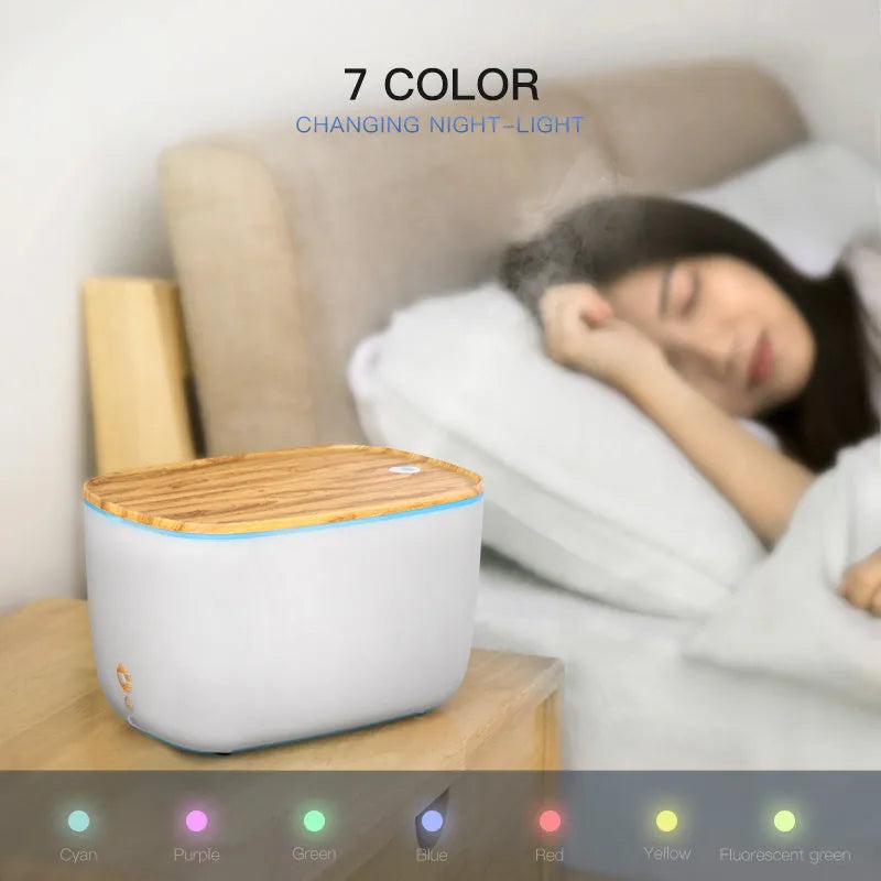 GX-22K white household atomizer humidifier and diffuser with night light on a wooden table