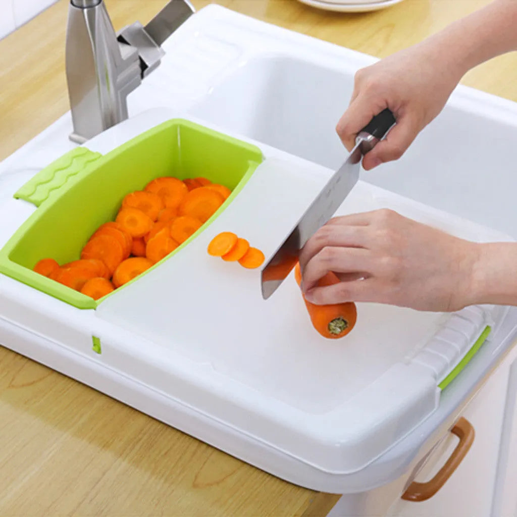 Green kitchen drain cutting board with drainage holes and storage trough mounted on a sink