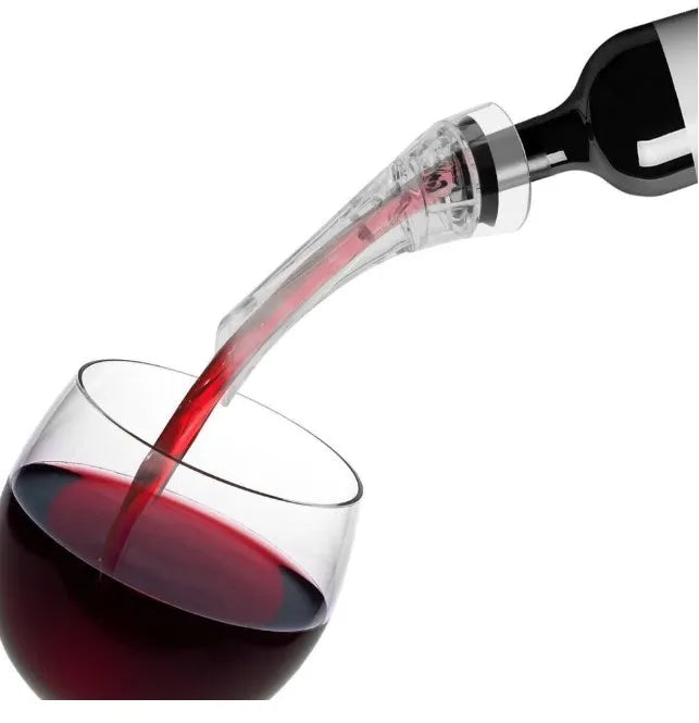 Clear acrylic wine aerator with stainless steel filter, shown next to a wine glass.
