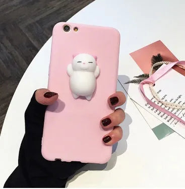 Close-up of a soft silicone iPhone case with a 3D cartoon cat design.