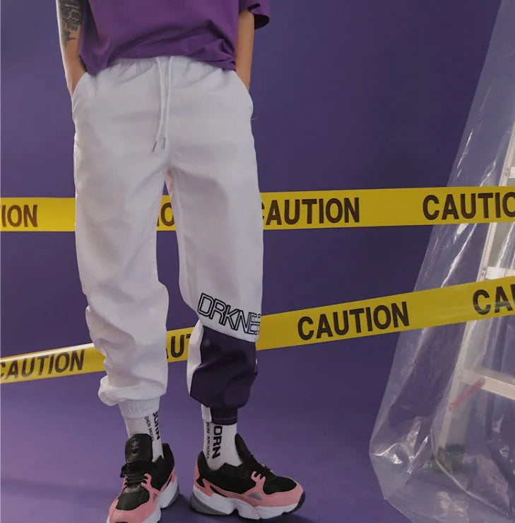 Japanese hip hop trousers with hit colour stitching, letter print, and bouquet foot detail in green low-waist drawstring style