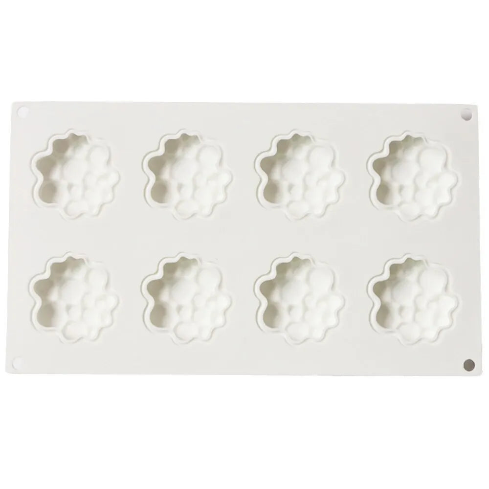 Round silicone baking mould with eight raised bubble cavities for tower cakes.