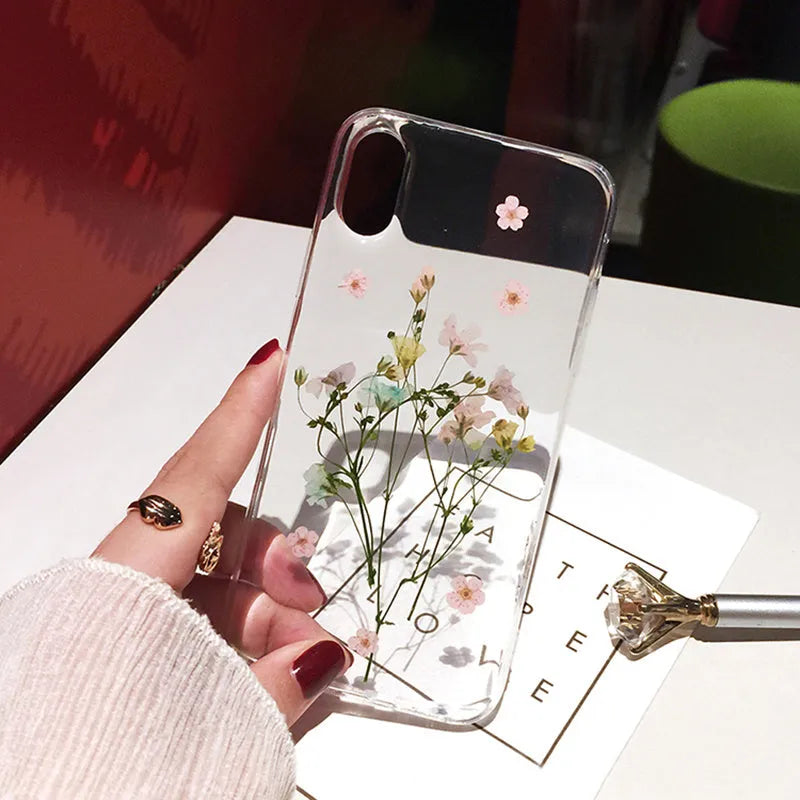 Clear iPhone case with dried flowers in epoxy resin back panel, soft TPU protective cover