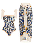 Women's printed two-piece chiffon swimsuit with a matching hip skirt in a floral design.