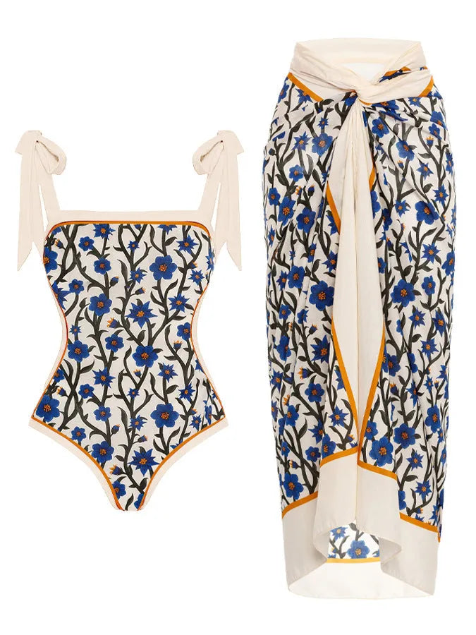 Women's printed two-piece chiffon swimsuit with a matching hip skirt in a floral design.