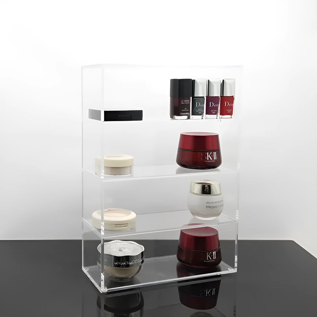 Clear acrylic cosmetics storage box 24x10x34cm on a vanity table holding makeup and skincare products