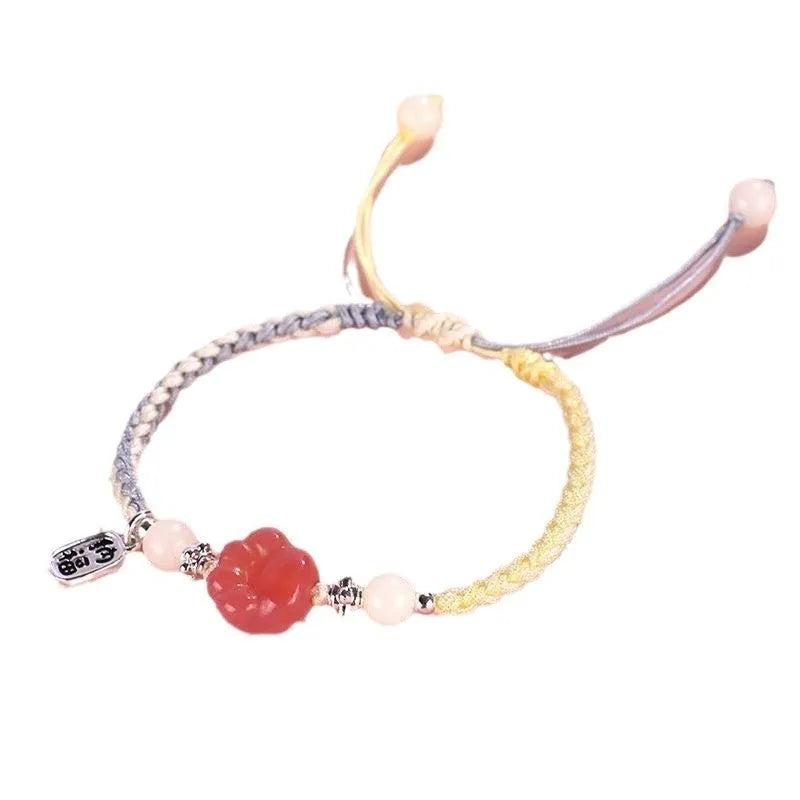 Red cat's paw charm couple bracelet in pastoral woven style with pink or yellow options
