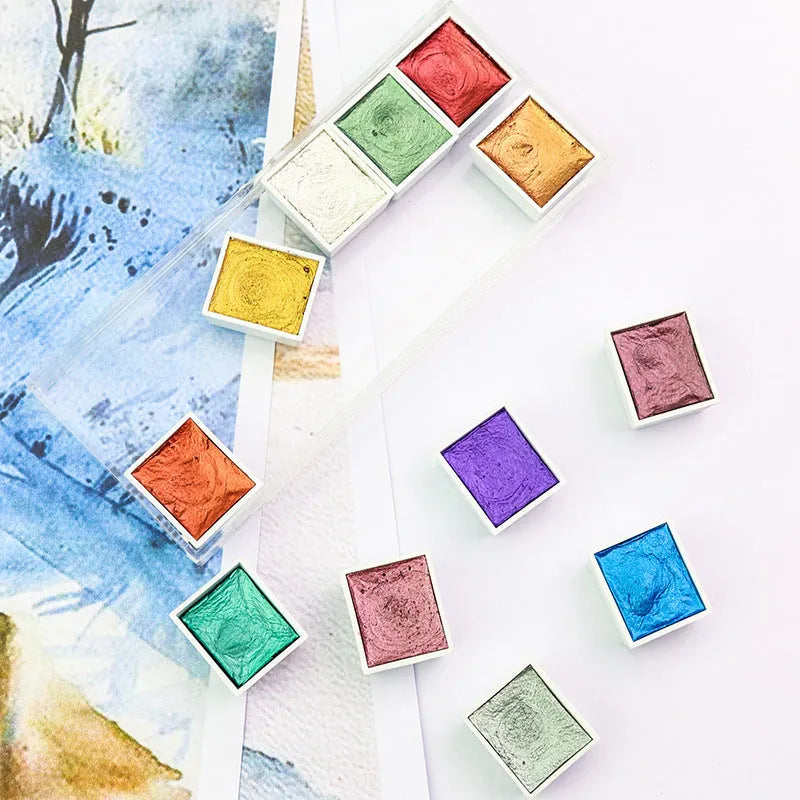 Boxed solid watercolour pigment set with pearlescent finishes in three colour system options