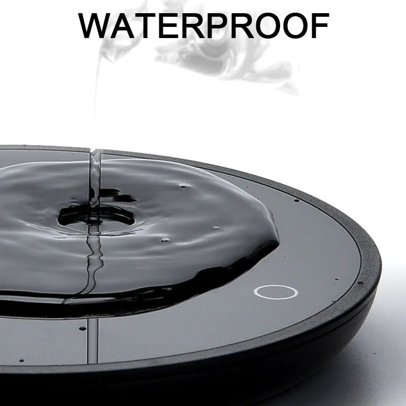 Black electric cup warming pad with tempered glass surface and dual temperature controls