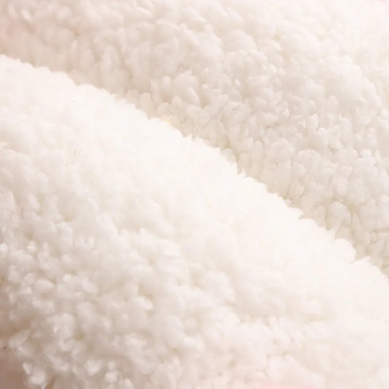 Blue enclosed cat nest with fluffy fleece interior, shown with a removable washable cover.