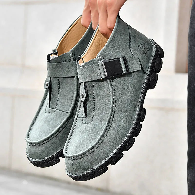 Men's black casual slip on shoes with handmade stitching and flat soles