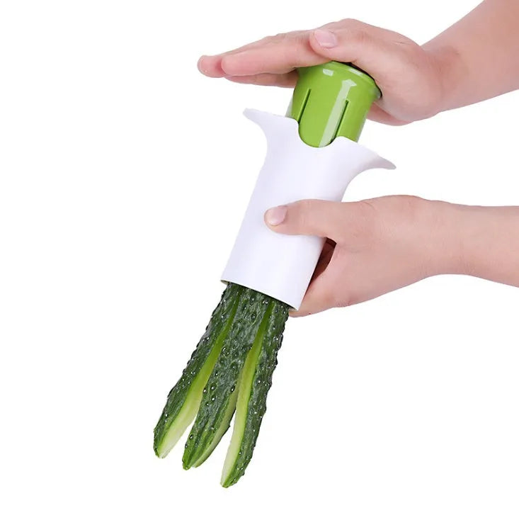 White kitchen vegetable fruit slicer with six stainless steel blades for cutting cucumbers carrots strawberries.