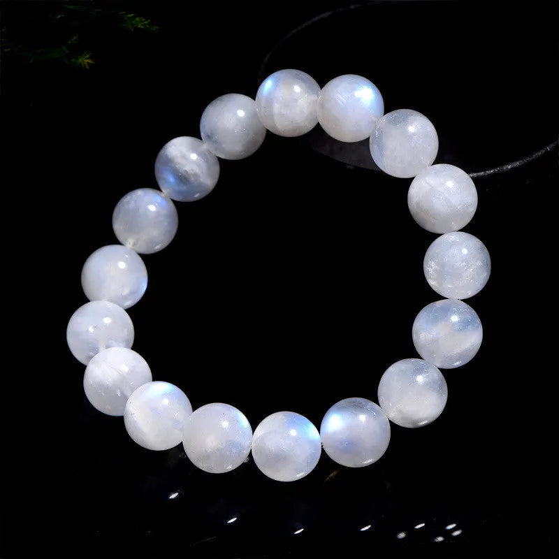Polished moonstone bracelet with round blue beads showing natural colour variations