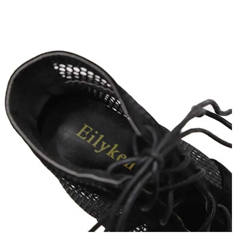 Black suede women's lace-up high heel shoes on a 11.5 cm heel.