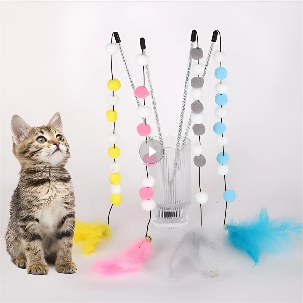 Grey, yellow, and blue acrylic pompon cat teaser stick with feather and bell, shown at 31cm length.