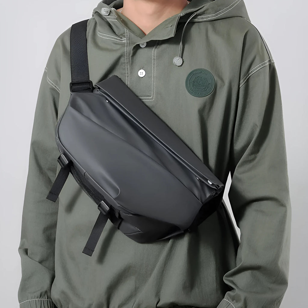 Grey men's medium crossbody bag with zipper opening and shoulder strap