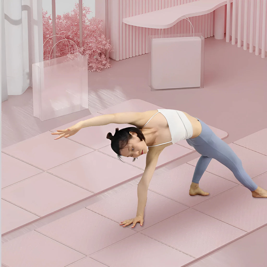 A folded and unfolded purple TPE gymnastic mat on a floor, showing its portable design.