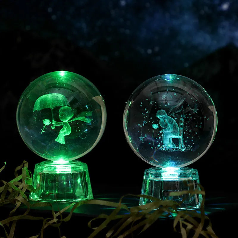 Transparent white crystal ball ornament with inner carving on wooden table with night lamp