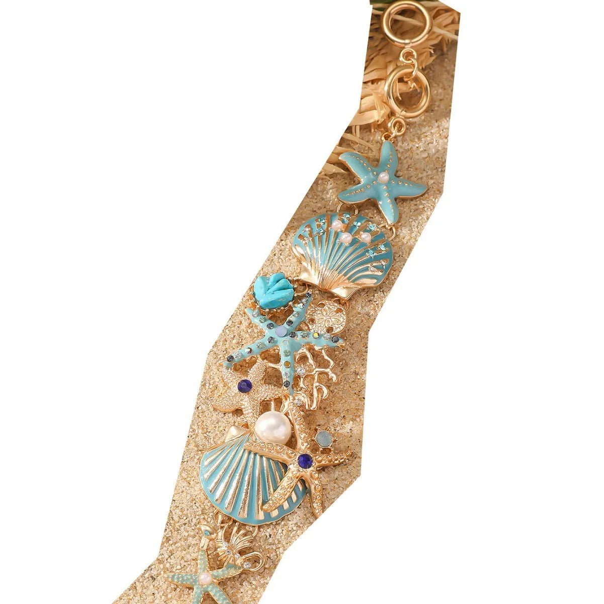 Women's alloy marine bracelet with starfish and anchor detailing in turquoise, red or blue coral colour.
