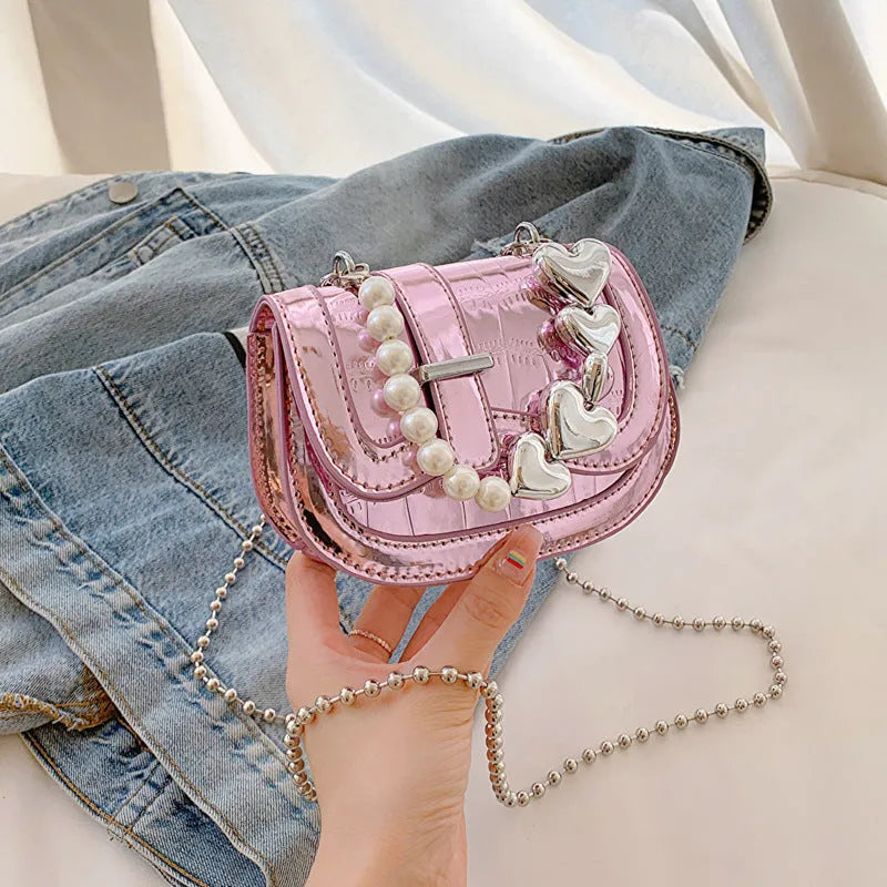 Women's silver PU mini saddle crossbody bag with phone pocket and single shoulder strap