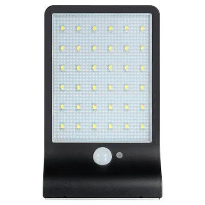 Black and white outdoor solar-powered garden light with LED illumination for pathways.