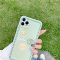 Green iPhone case with smiley face and polka dot geometric design on a soft rubber TPU back cover.
