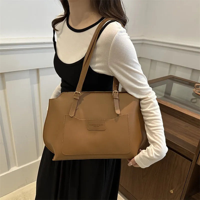 PU tote bag in horizontal square shape with double shoulder straps and visible sewing line detailing