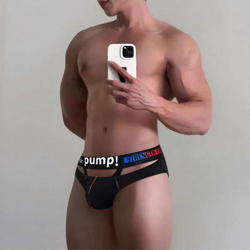 Men's solid black low-waist modal fabric briefs laid flat, showing the waistband and leg openings.