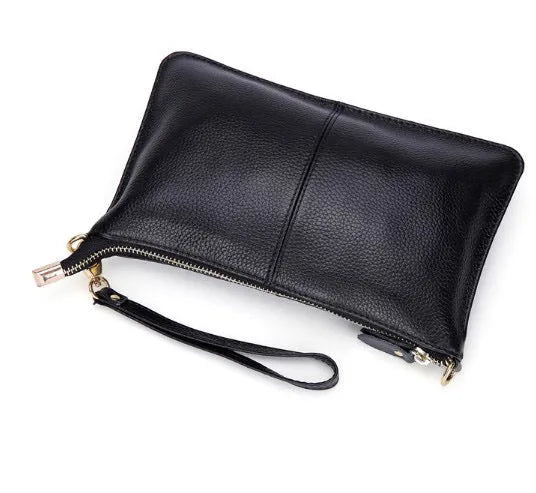 Cowhide ladies slant bag showing internal phone and certificate compartments with hand strap and shoulder strap