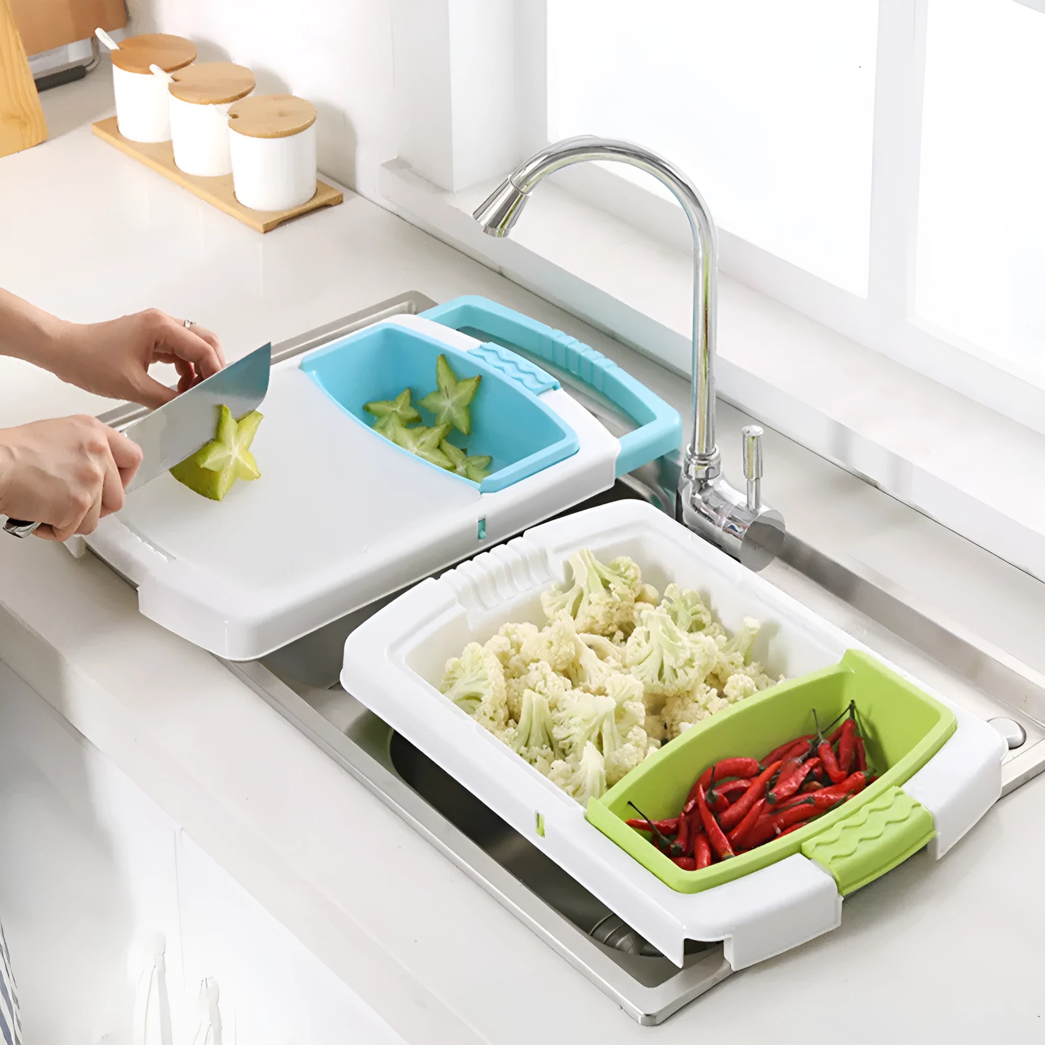 Green kitchen drain cutting board with drainage holes and storage trough mounted on a sink