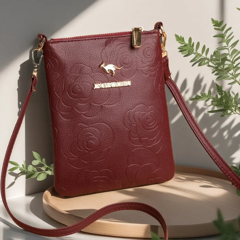 Soft PU leather shoulder messenger bag in a square vertical shape with a file compartment, shown in a floral stone pattern colour.