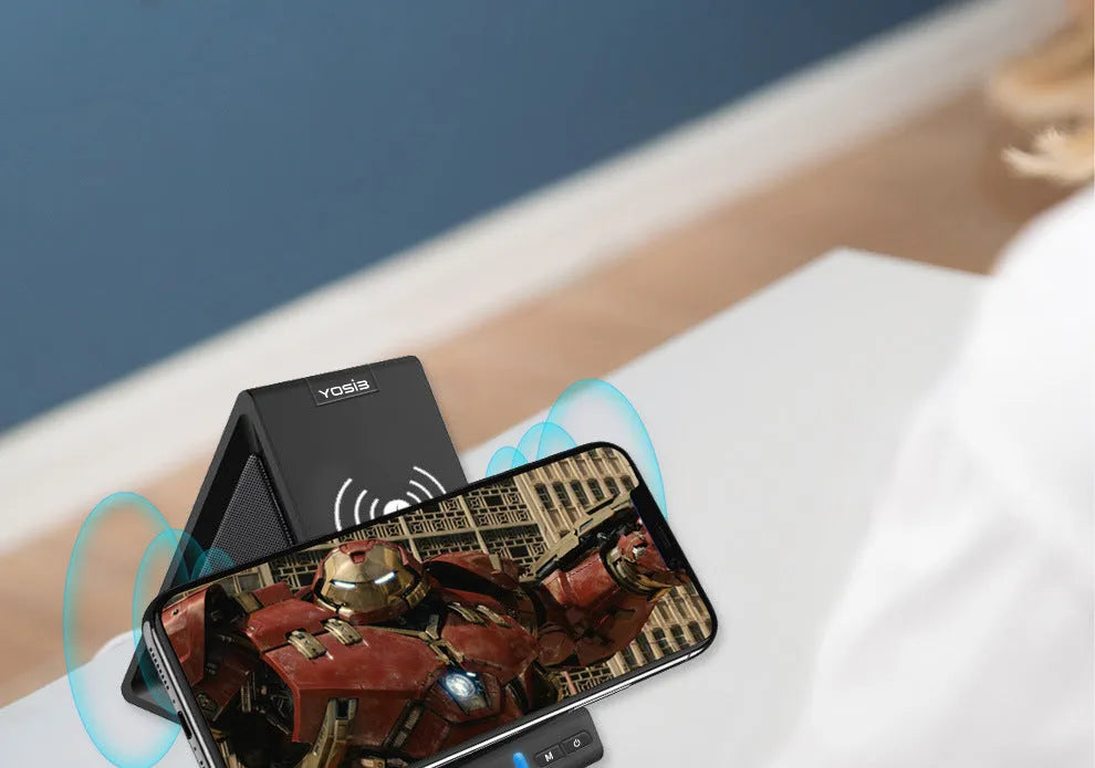 Black multifunction Bluetooth speaker with integrated mobile phone charging stand and holder.