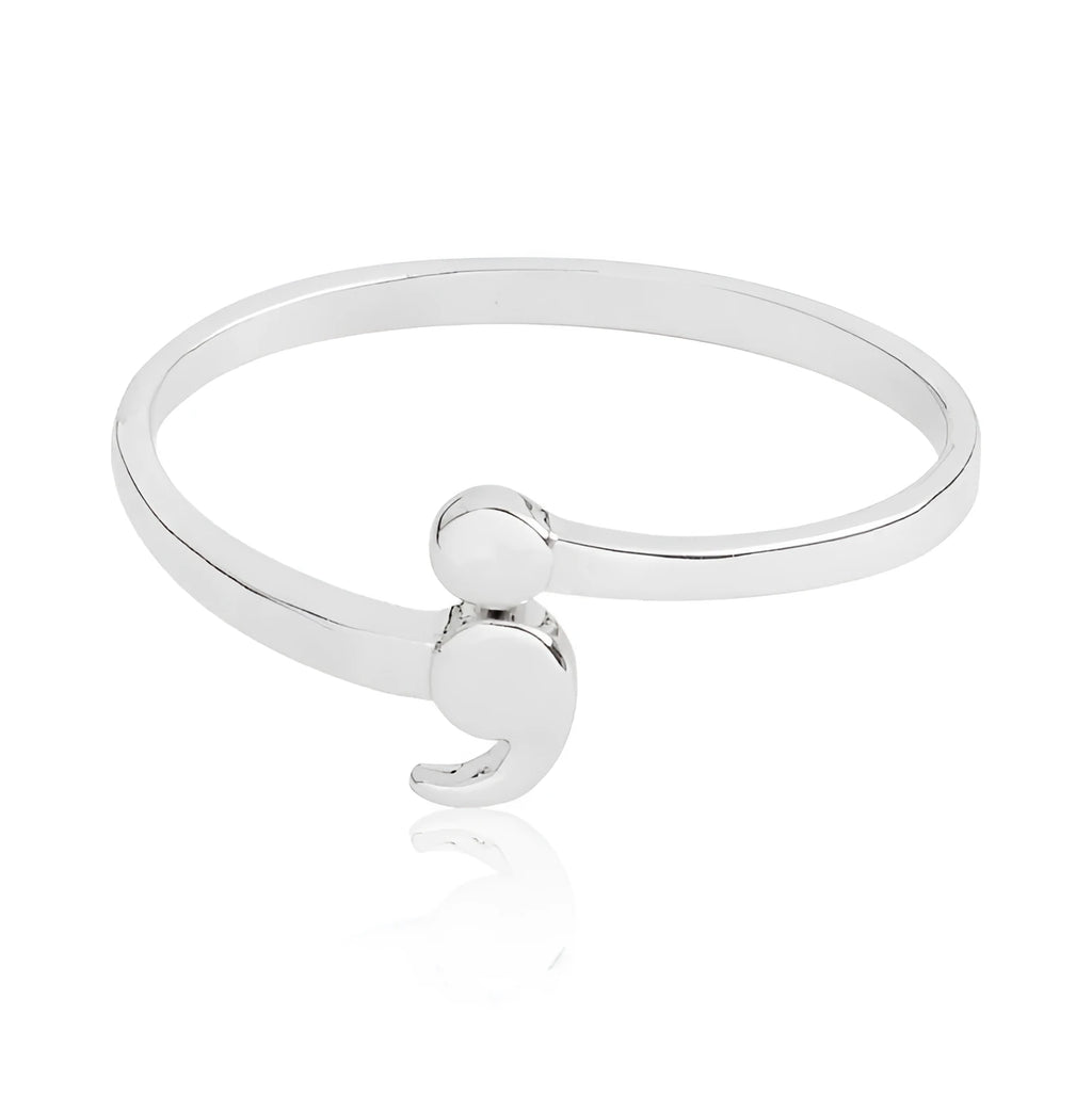 Women's silver-tone alloy ring available in sizes 5 to 10, simple band design