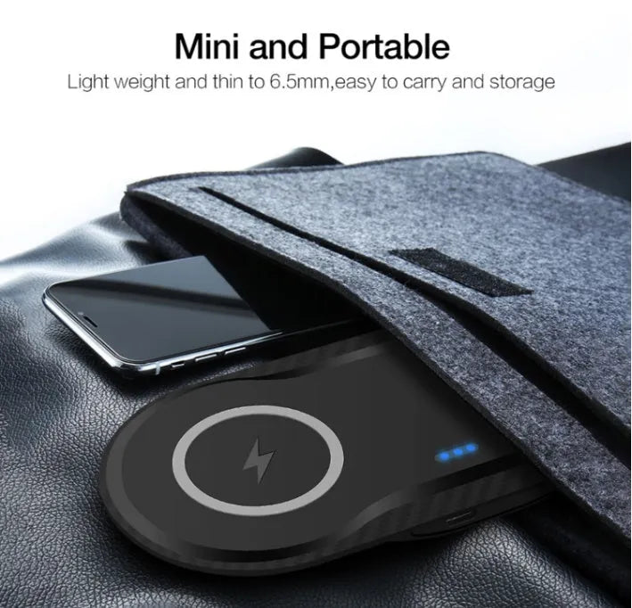 Black dual wireless charging pad showing two smartphones charging simultaneously on a desk.