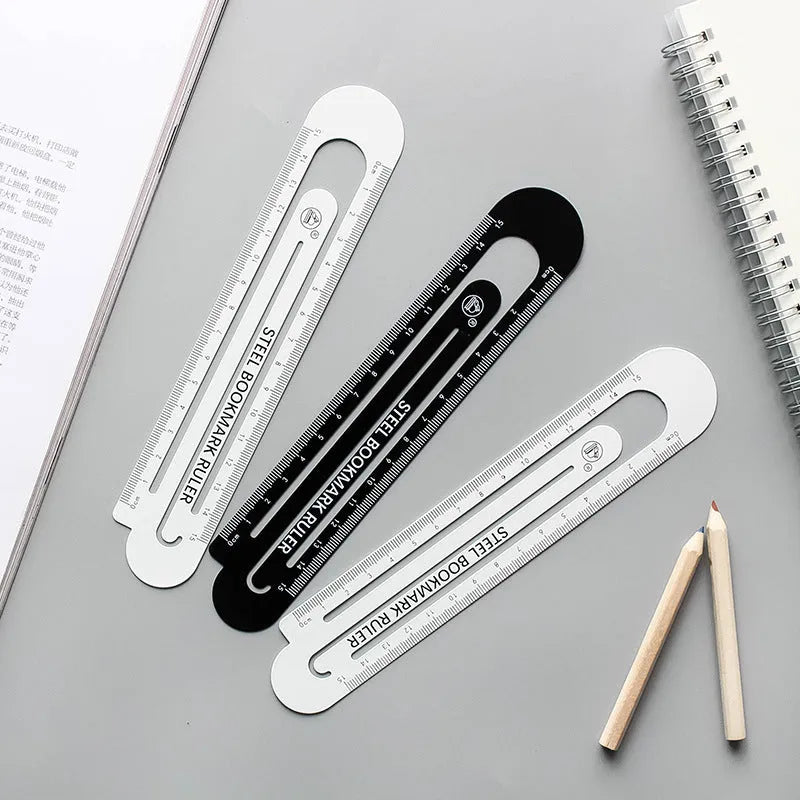Black and white two-sided steel ruler measuring 12cm in length