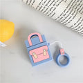 Silicone protective sleeve for AirPods 1 and 2 charging case with hanging ring, available in dark blue, green, purple, and yellow colours