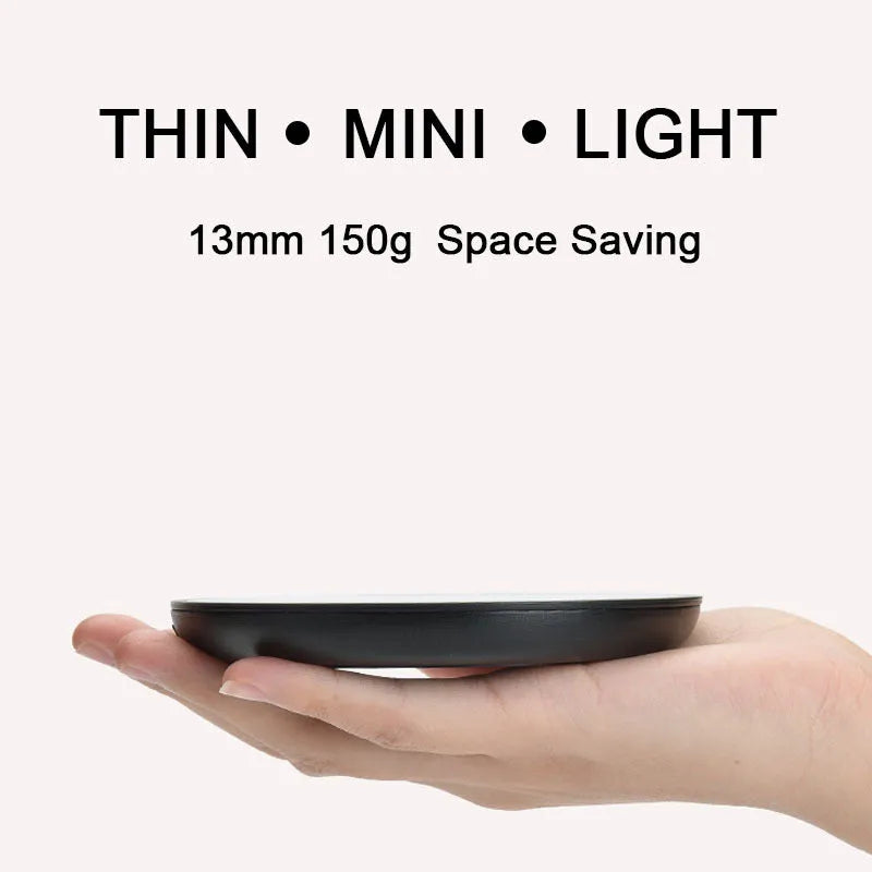 Black electric cup warming pad with tempered glass surface and dual temperature controls