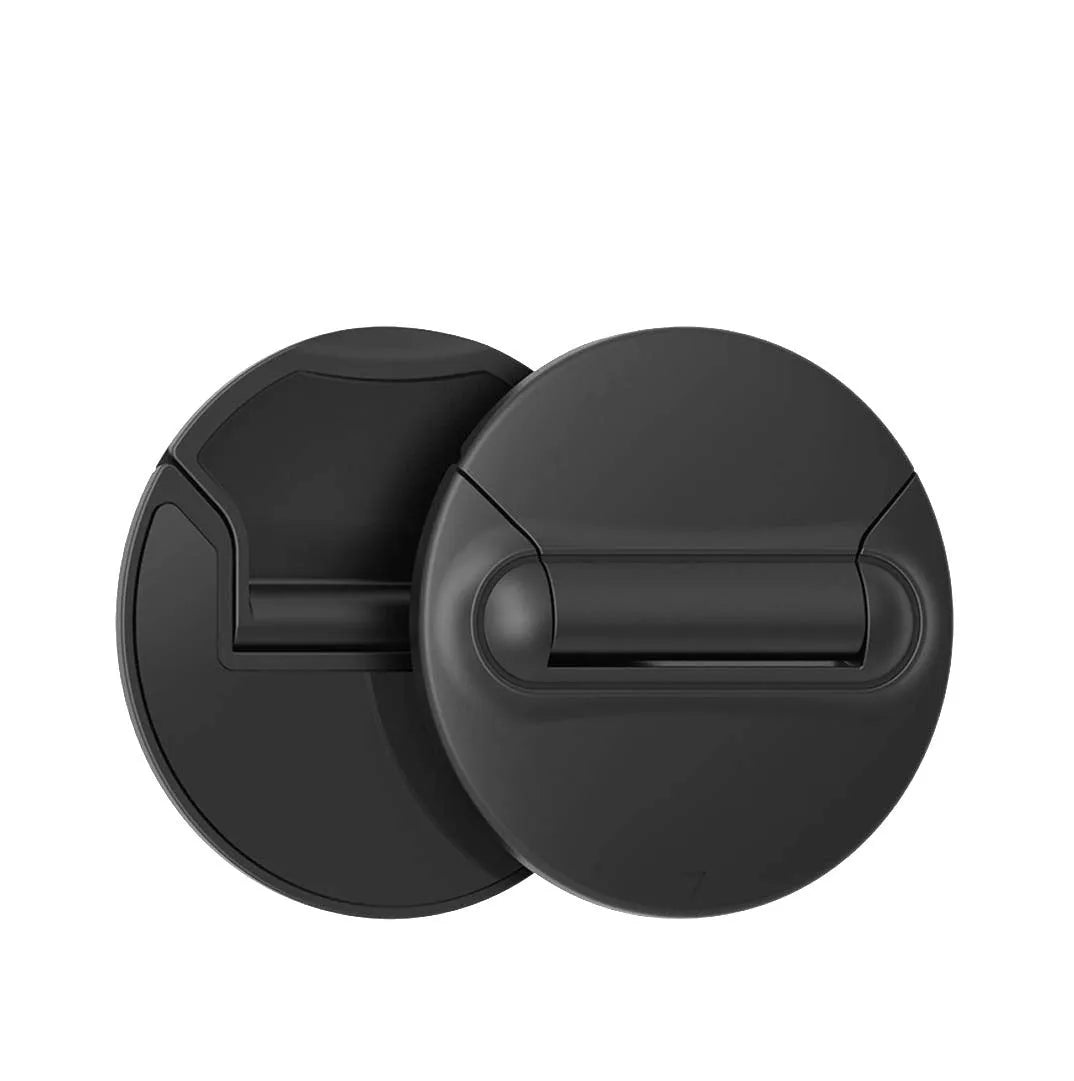 Two black ABS mini laptop stands on a desk, each 50x50x6.5mm, packaged as a 2-pack