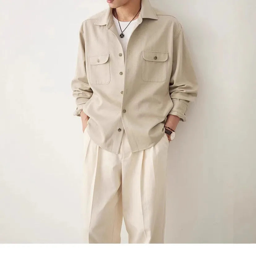 Men's light sand rice cotton lapel long sleeve shirt on a hanger.