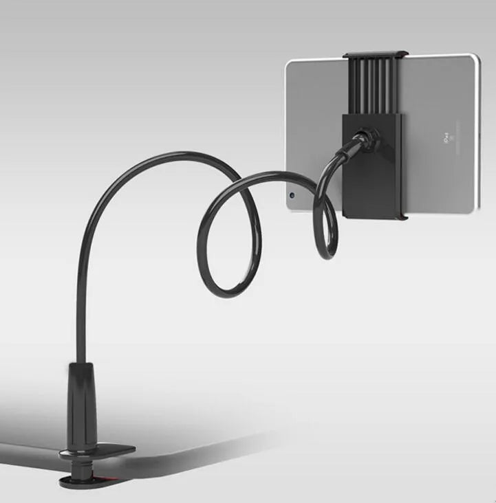 Black oversize bedside phone holder with a long adjustable arm mounted on a wooden table.