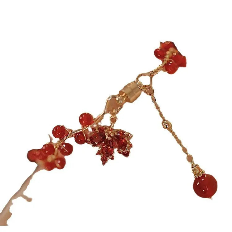 Red ginkgo leaf charm on a silver-toned magnetic alloy bracelet in Chinese natural style.