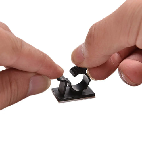 Ten black nylon adhesive cable clamps with two-stage lock design for 13mm cables.