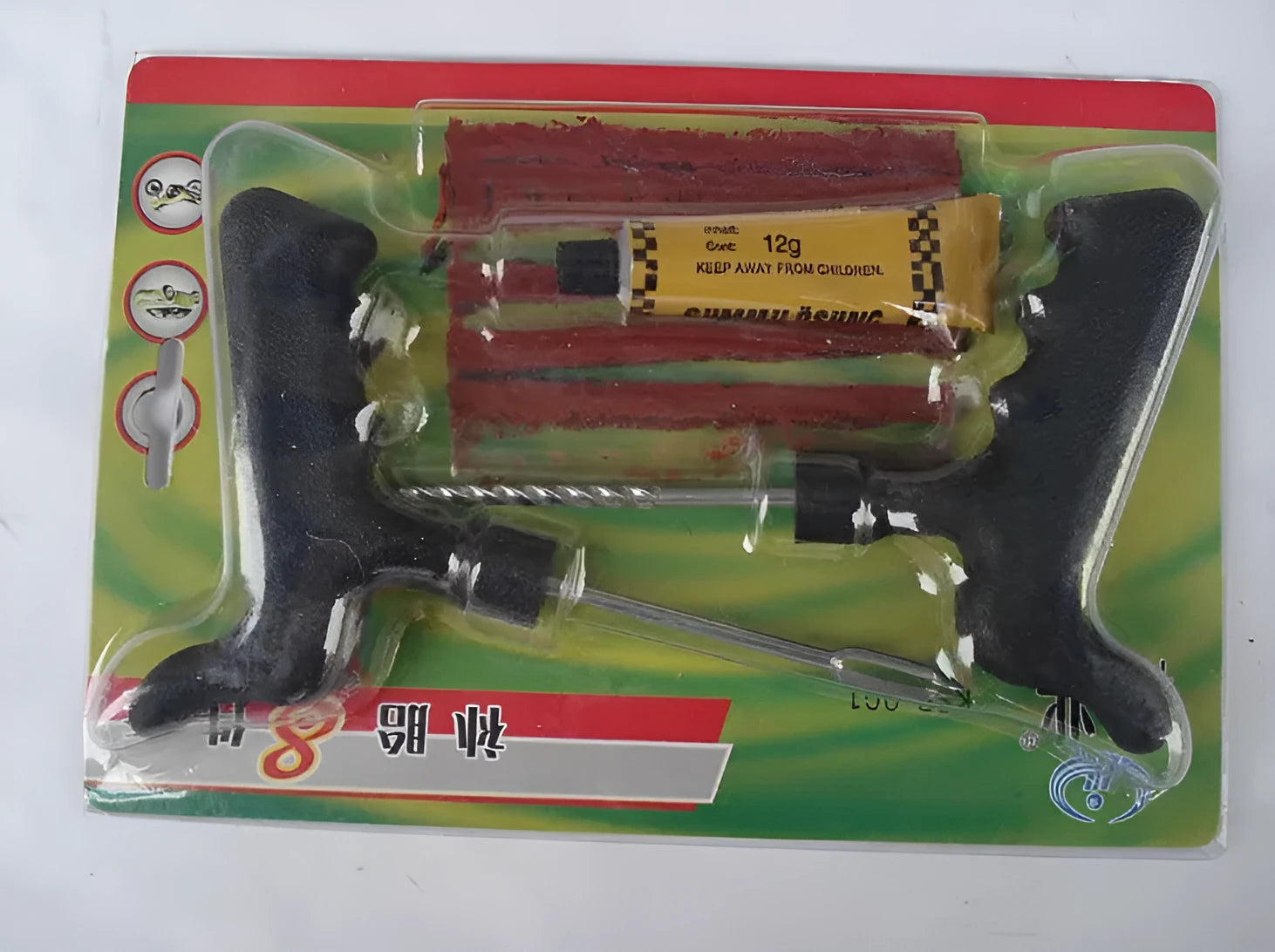 Eight piece vacuum tyre repair tool kit for car and motorcycle tyres on black background.