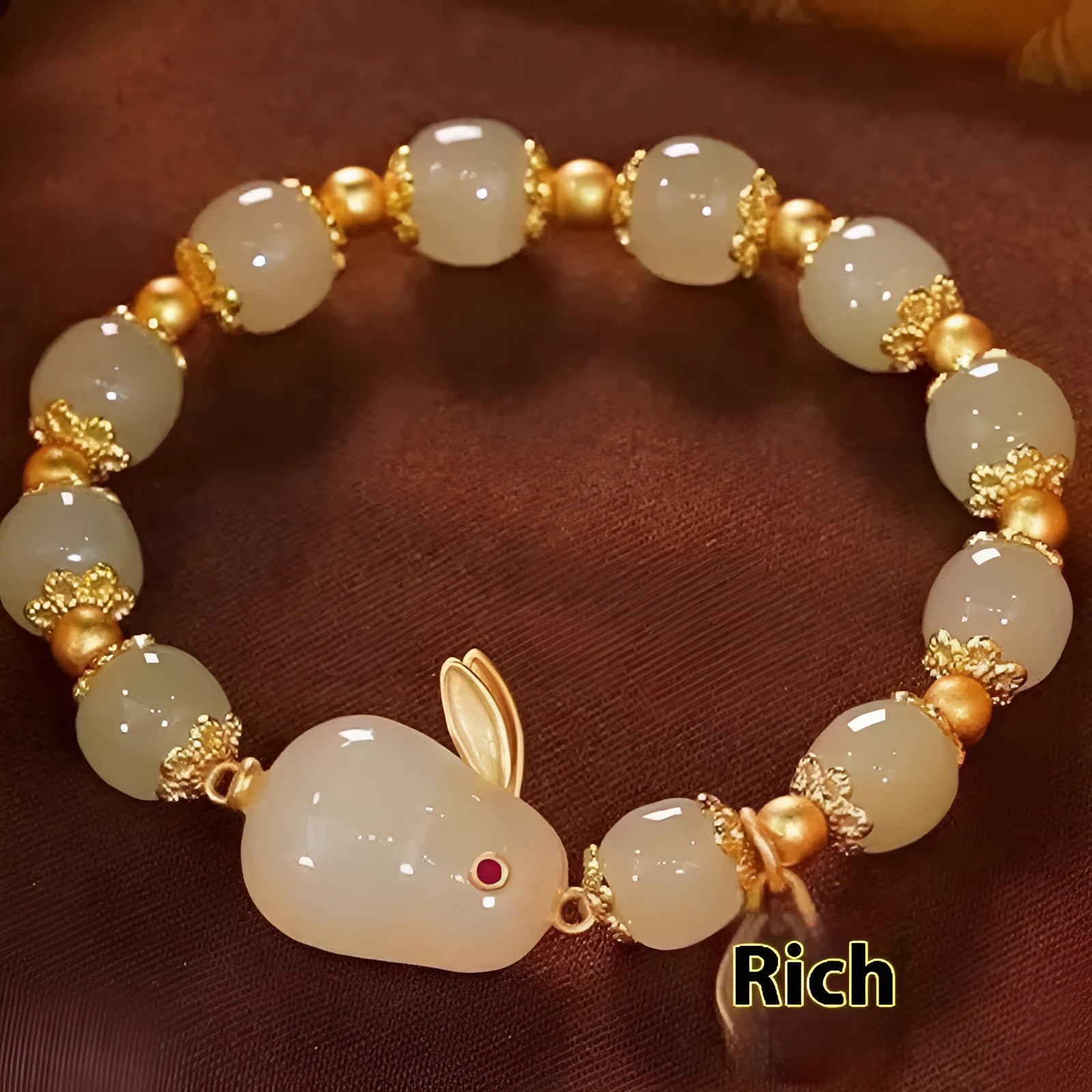 Green jade hare bracelet with Chinese zodiac design and electroplated finish