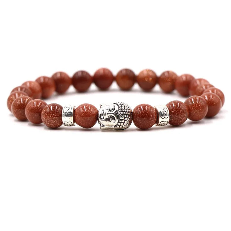 Tigereye and natural stone stretch bracelet with 8mm beads on a wrist.