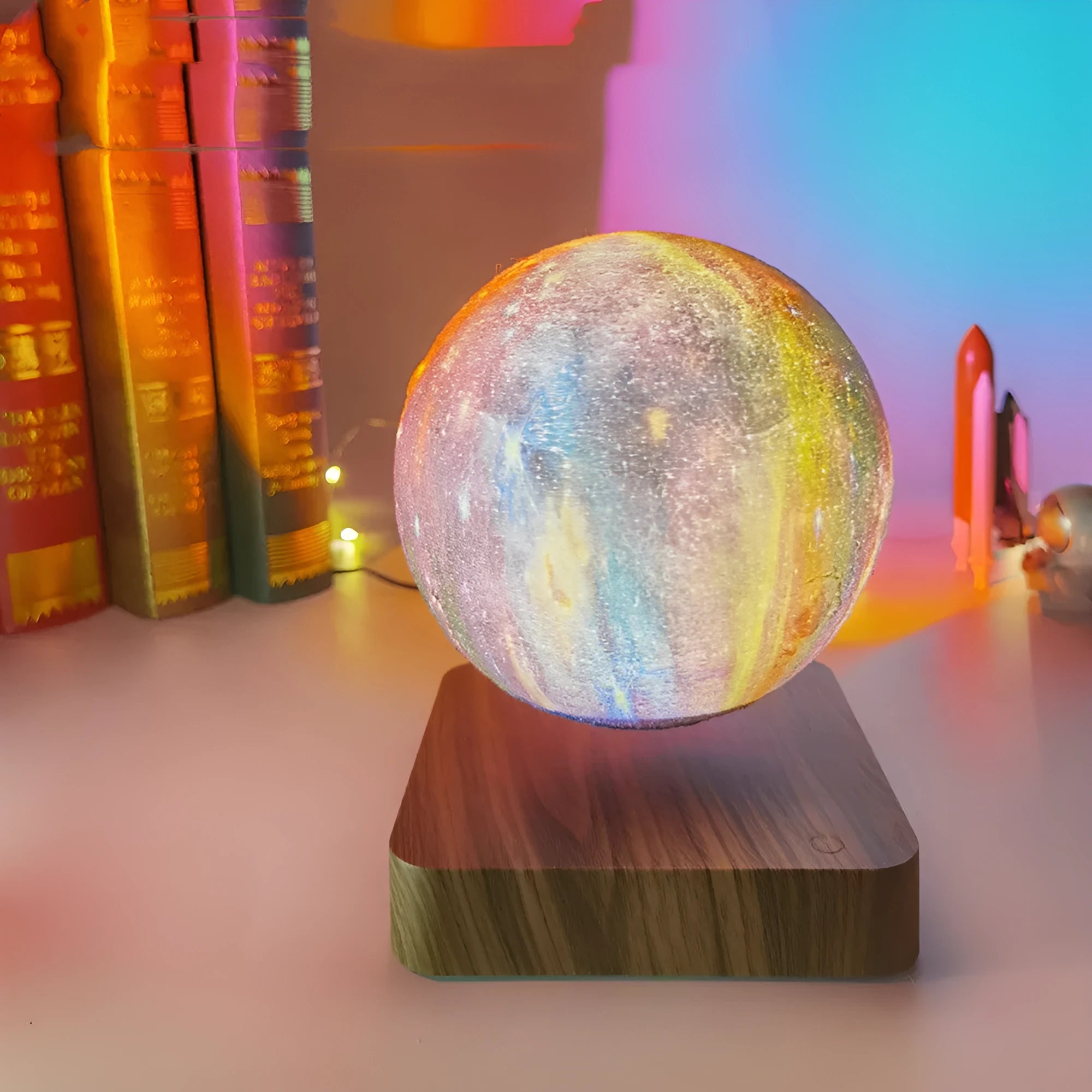 Magnetic levitation galaxy moon lamp floating above circular base with colourful lighting